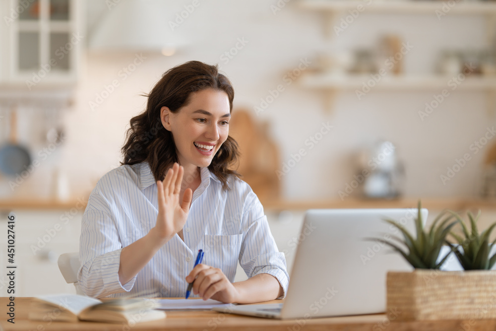 young woman working at home