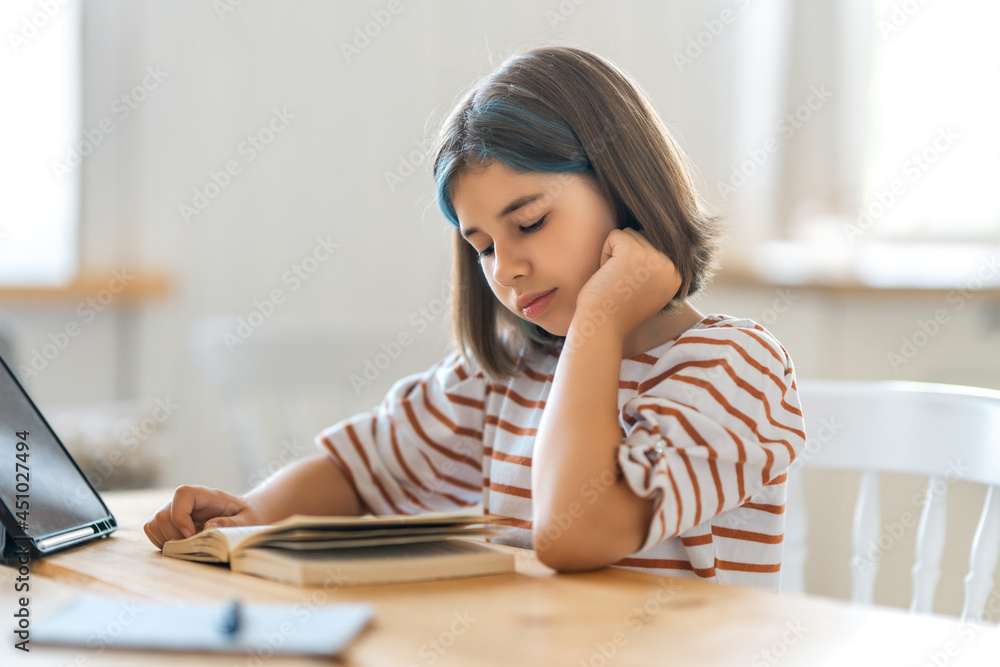 Girl doing homework or online education.