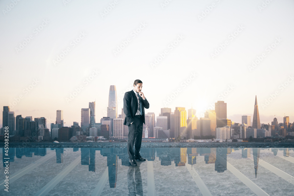 Business man on glass balcony looking into the distance at city with mock up place. Success and futu