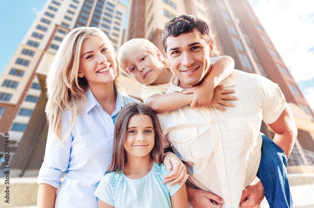 Beautiful smiling lovely family on outdoor background