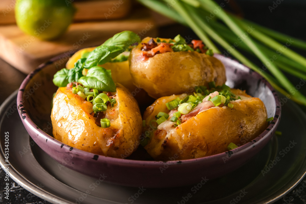 Plate with baked potato on table, closeup