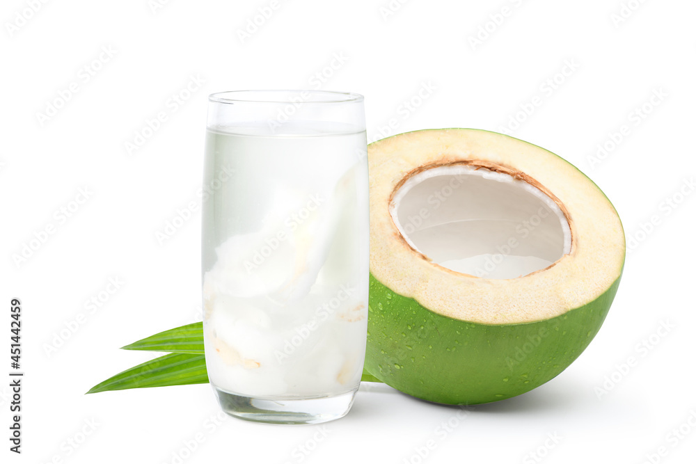 Glass of coconut juice with cut in half isolated on white background.