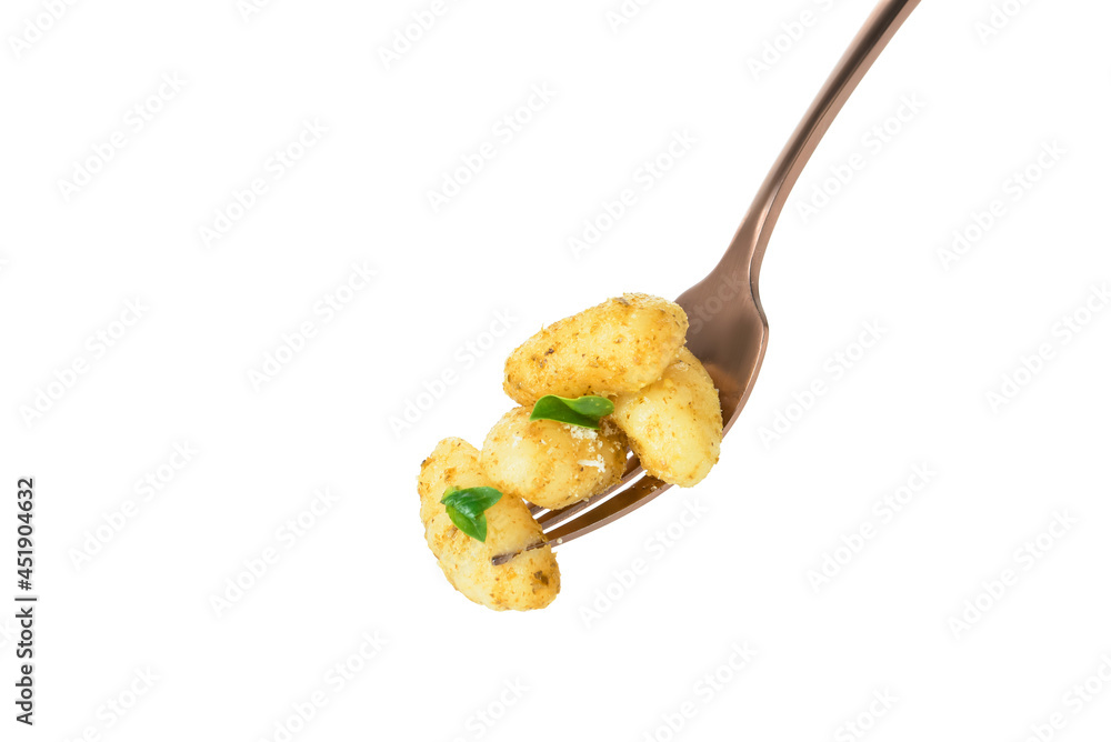 Fork with tasty pesto gnocchi on white background