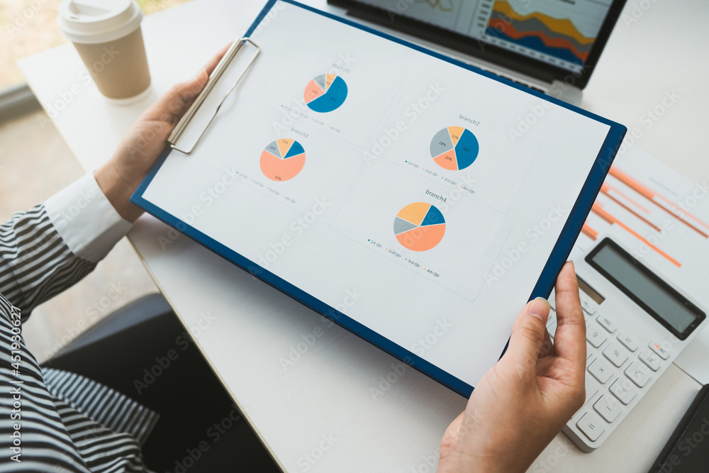 Close up audit woman calculate on paper document financial data.