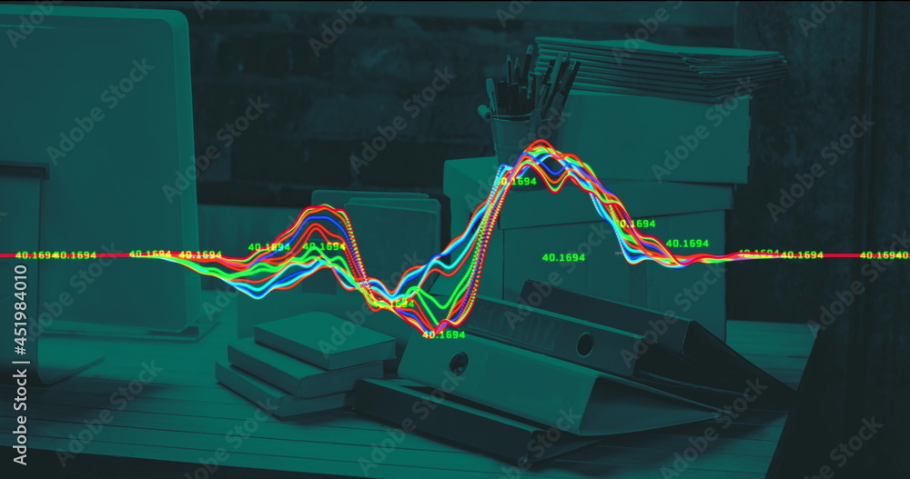 办公桌上波动线条的财务数据处理图像