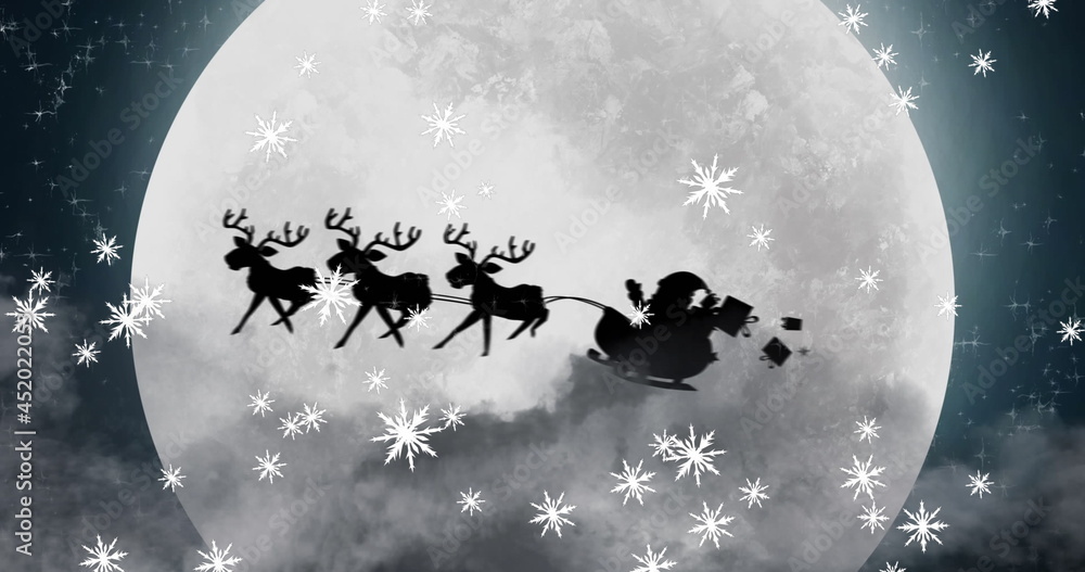 Image of black silhouette on santa claus in sleigh being pulled by reindeer with winter scenery 