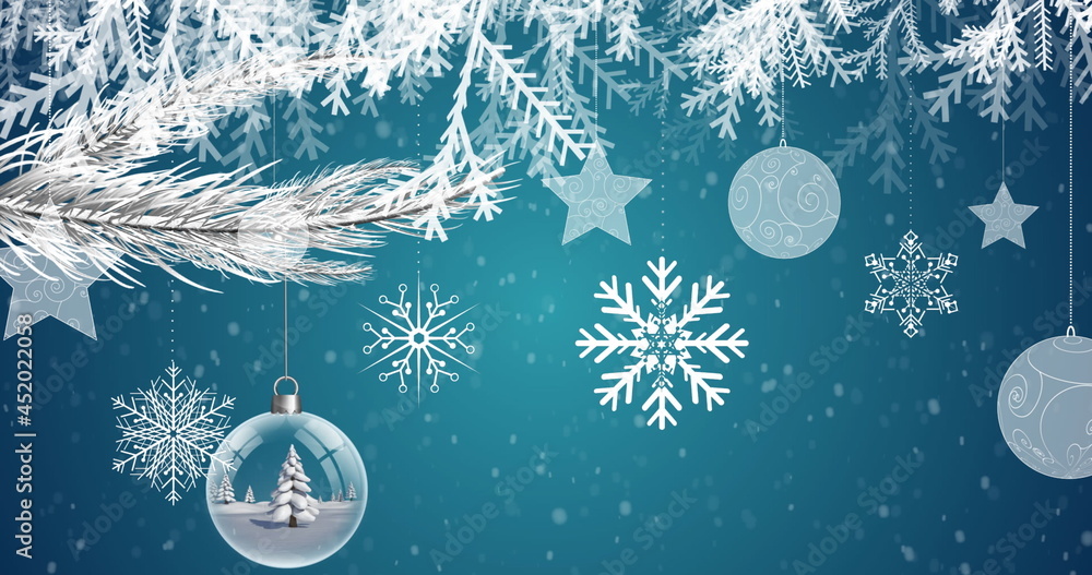 Digital image of snow falling over christmas decorations hanging against blue background