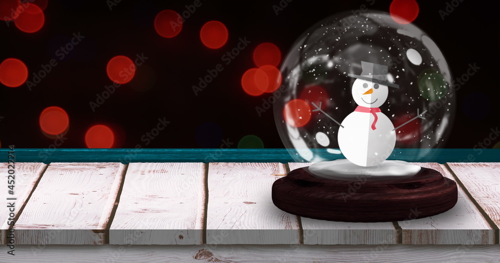 Image of snow globe with snowman with flickering christmas red fairy lights on black background