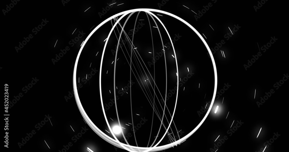 Image of spinning white rings on black background with white lights