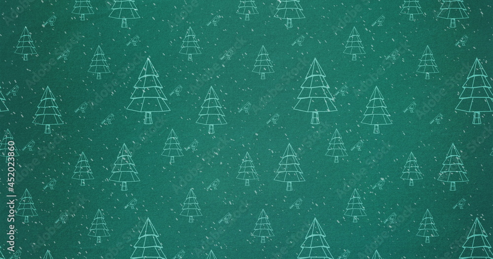 Image of christmas trees with snow falling on green