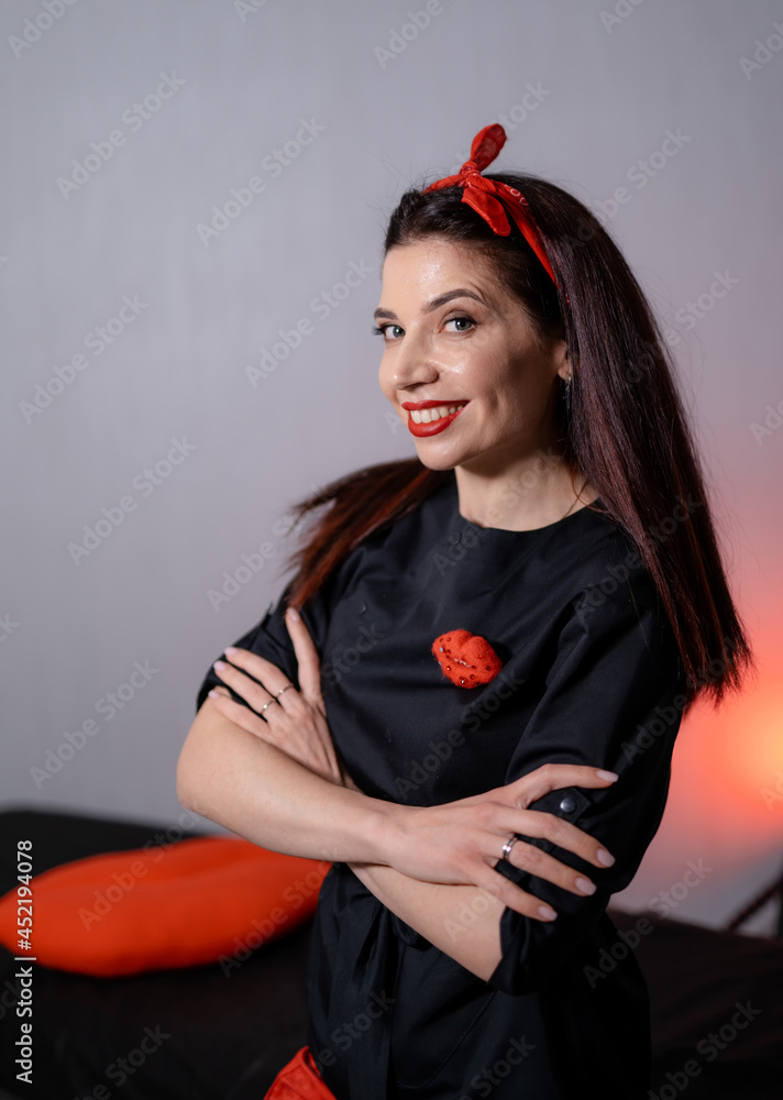 Cosmetologist posing arms crossed at her studio. Beautician female preparing to making permanent mak