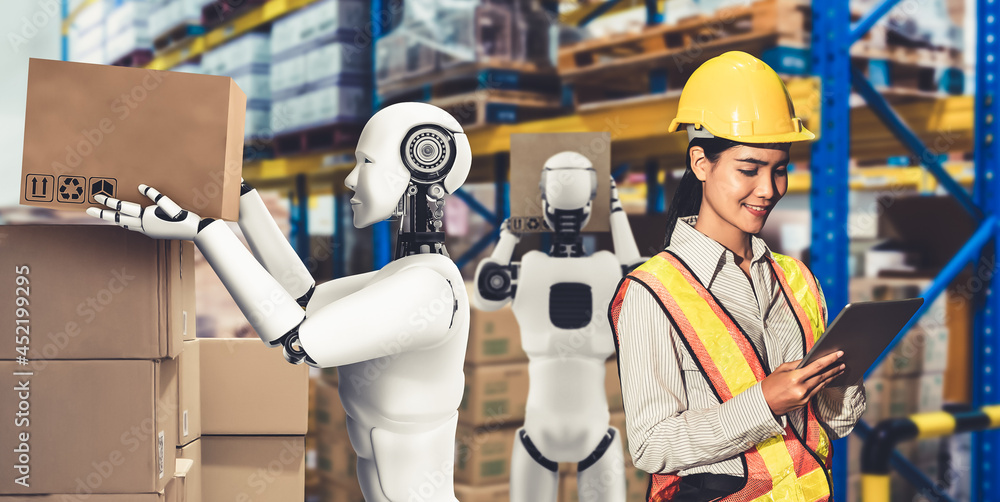 Innovative industry robot working in warehouse together with human worker . Concept of artificial in