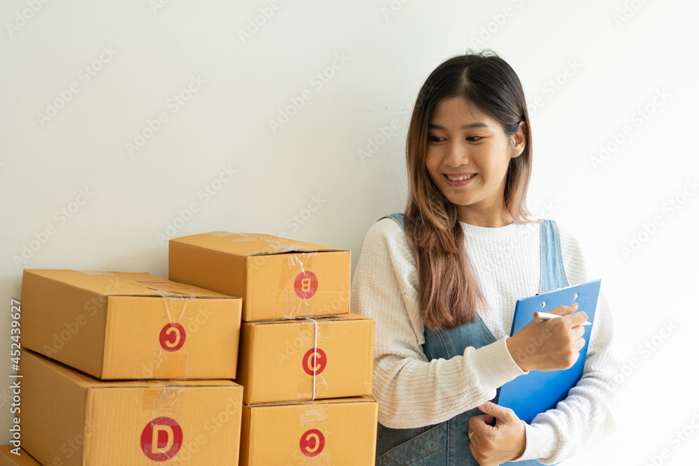 SME business online and delivery concept, freelance woman working at home with Online Parcel deliver