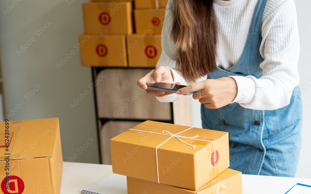 SME business online and delivery concept, freelance woman working at home with Online Parcel deliver