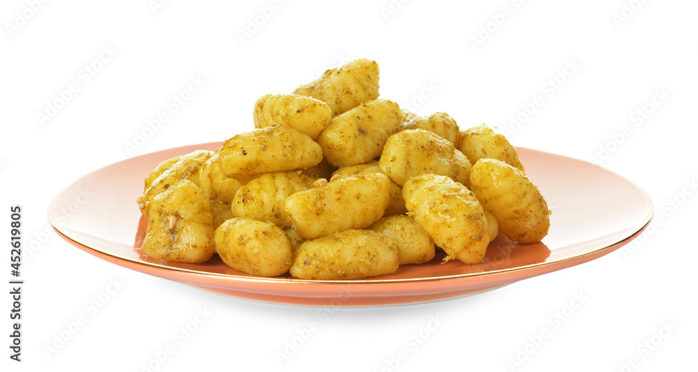 Plate with tasty pesto gnocchi on white background