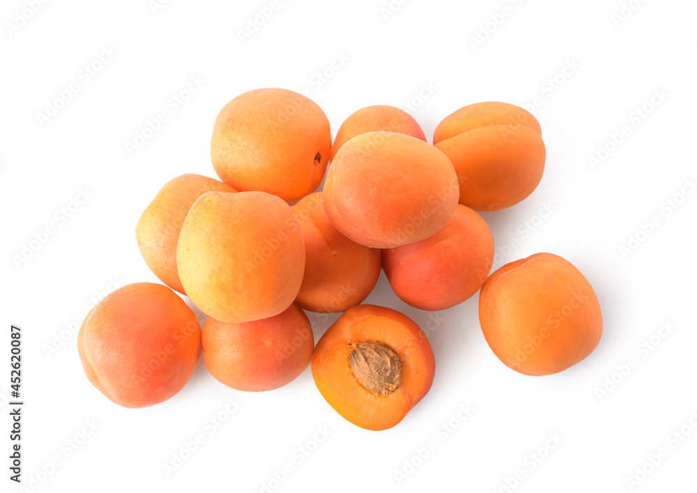 Tasty ripe apricots on white background