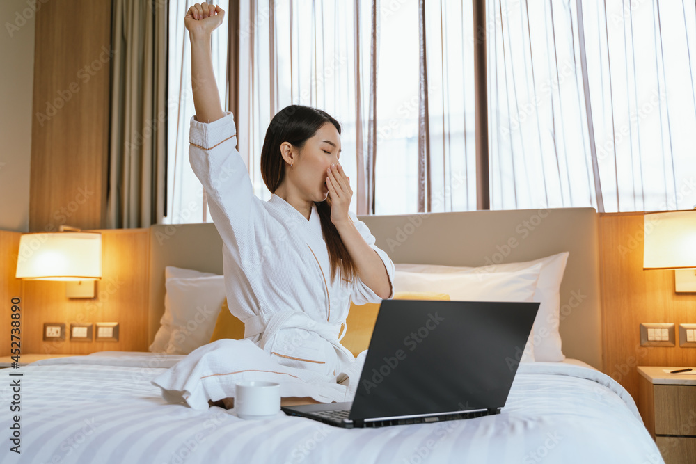 Asian woman Wake up in the Morning, Stretching on the Bed and get up in bedroom
