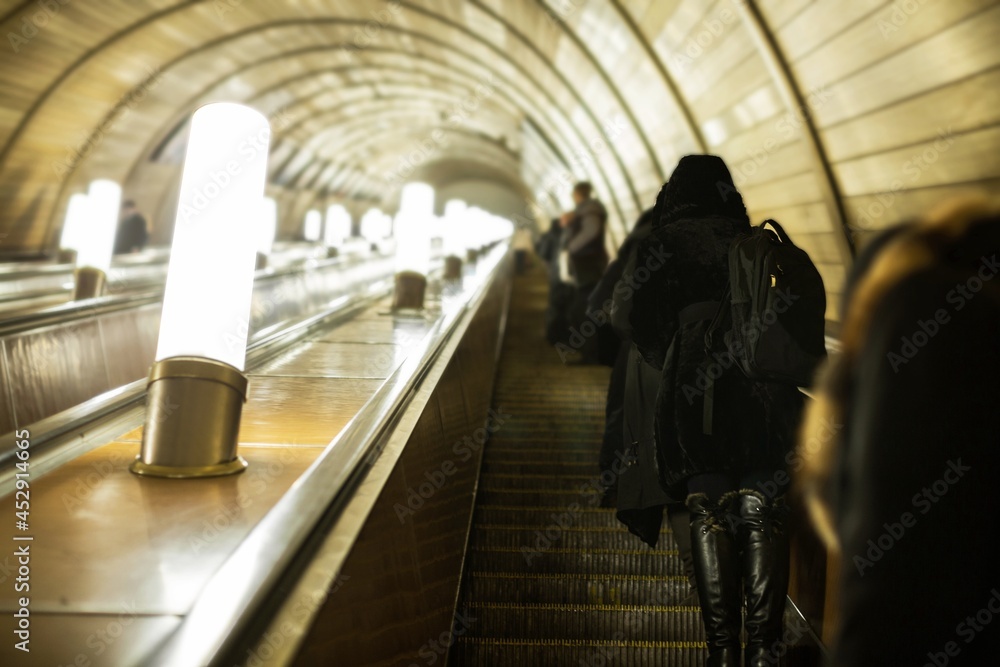 People on Escalator at Subway Station