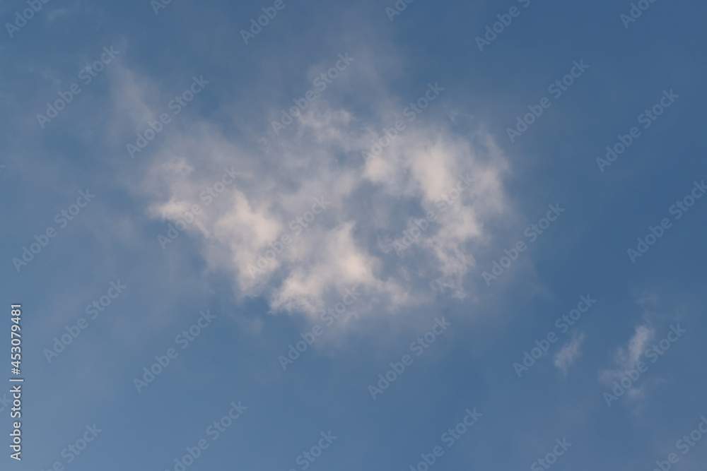 Bright white clouds over blue sky