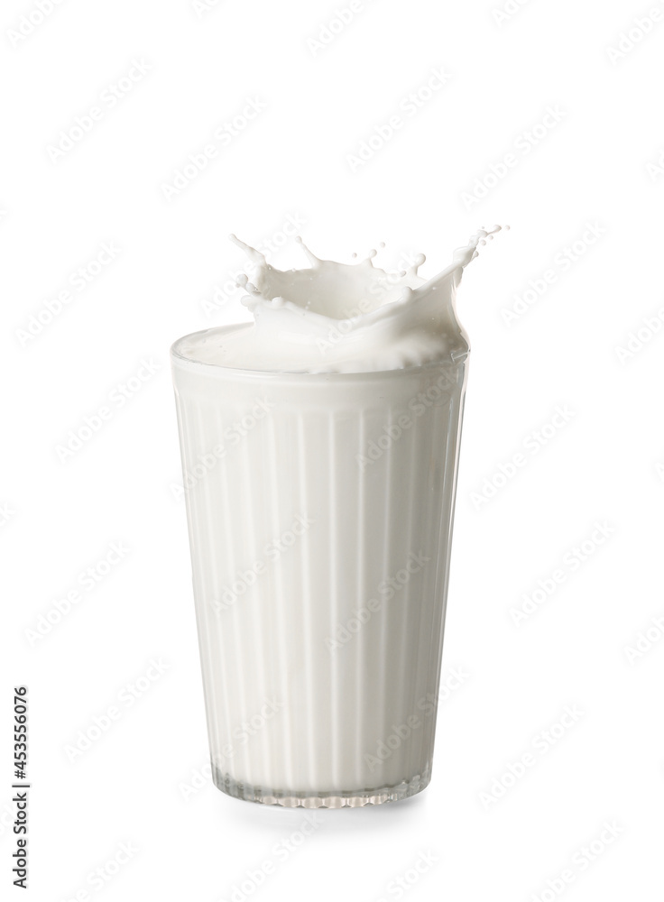 Glass of tasty milk with splashes on white background