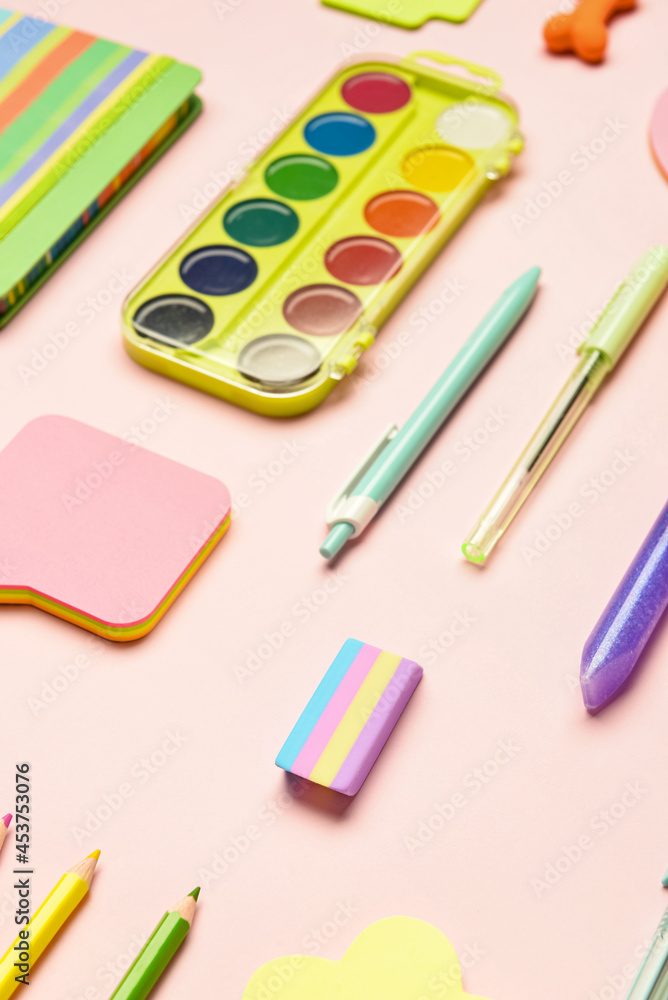 Stationery supplies on color background