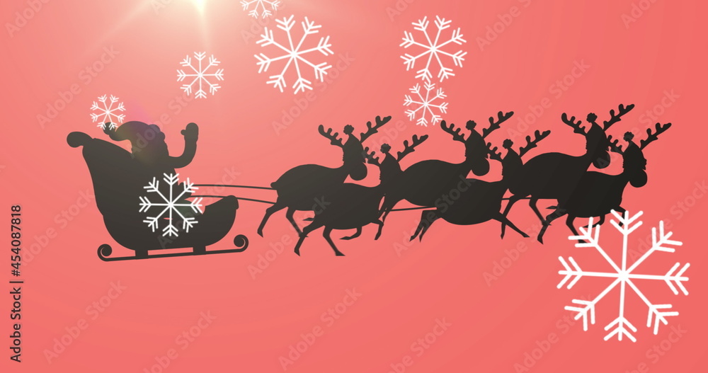 Digital image of snowflakes falling over black silhouette of santa claus in sleigh