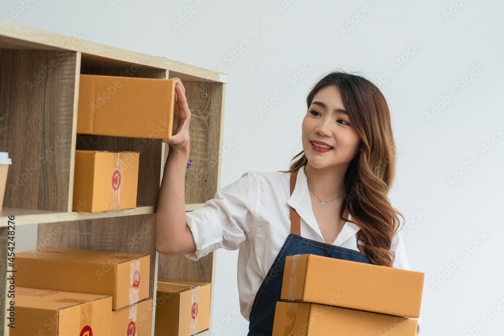 SME business online and delivery concept, freelance woman working at home with Online Parcel deliver