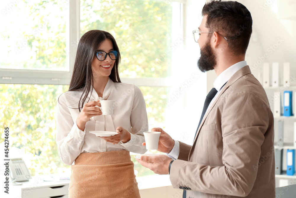 Business people having coffee break in office