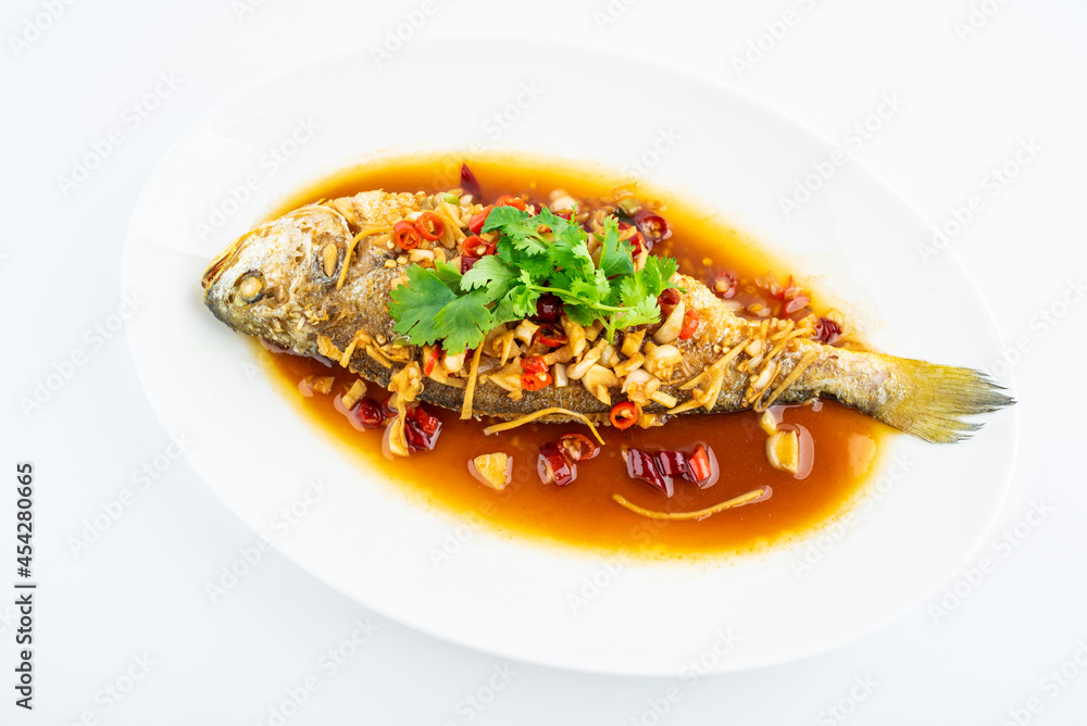 A braised yellow croaker on white background