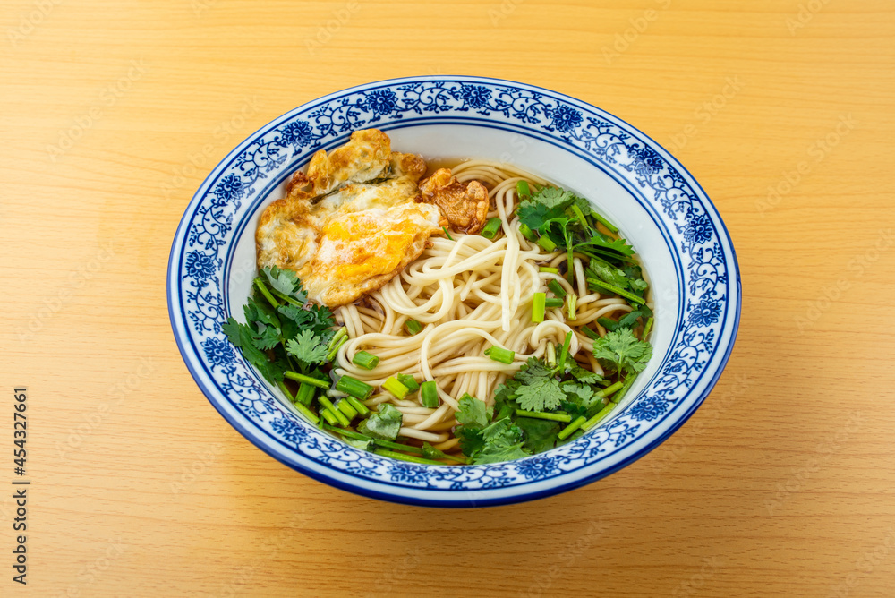 A bowl of egg noodles on the table