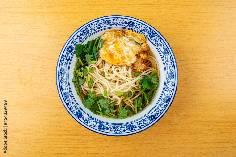 A bowl of egg noodles on the table