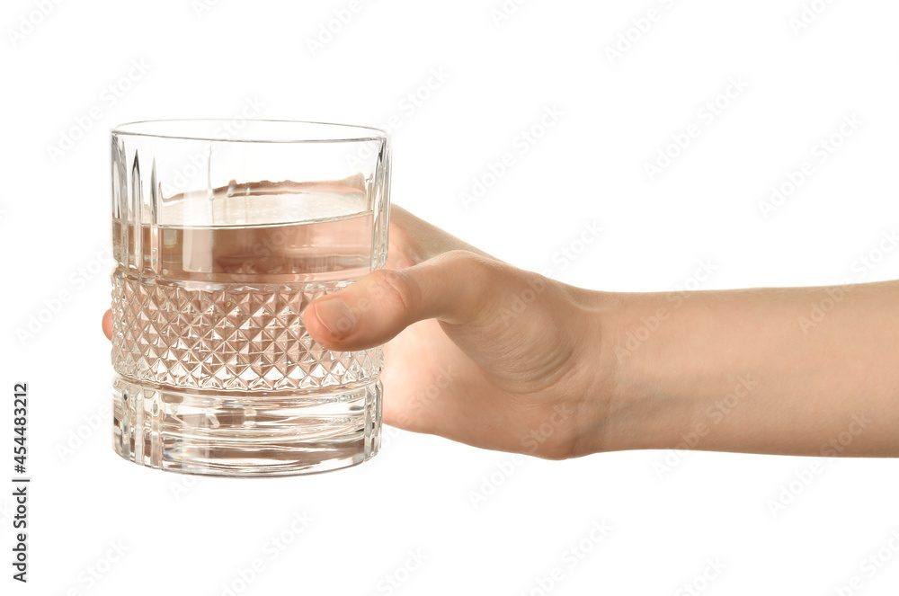 Female hand with glass of water on white background