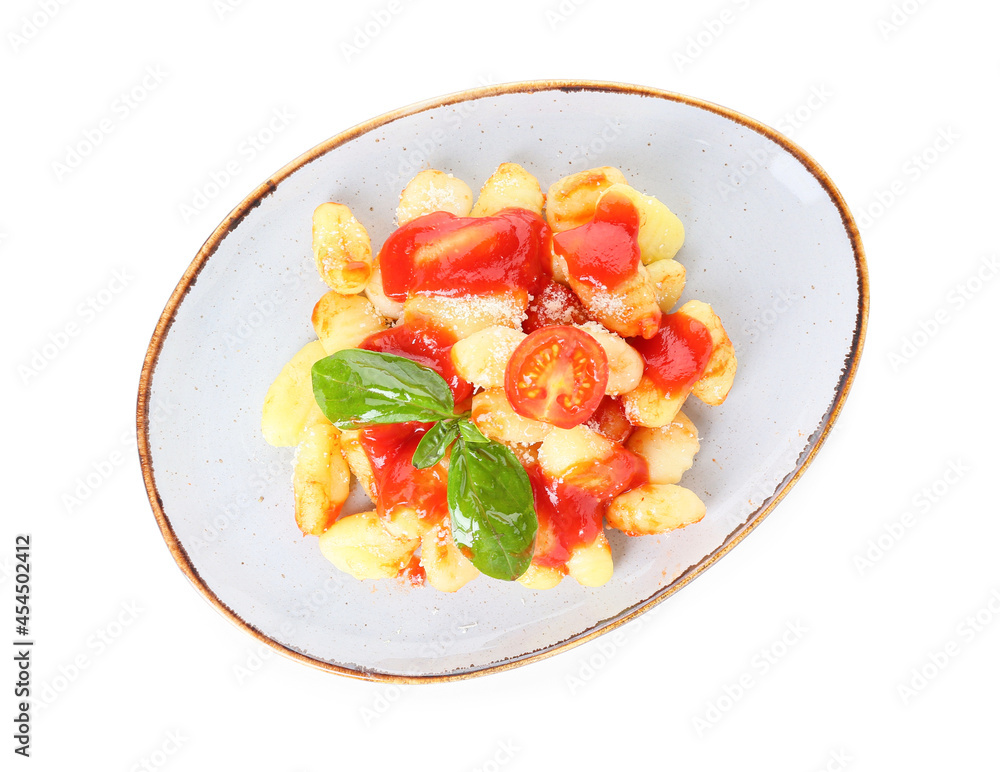 Delicious gnocchi with tomato sauce in plate on white background