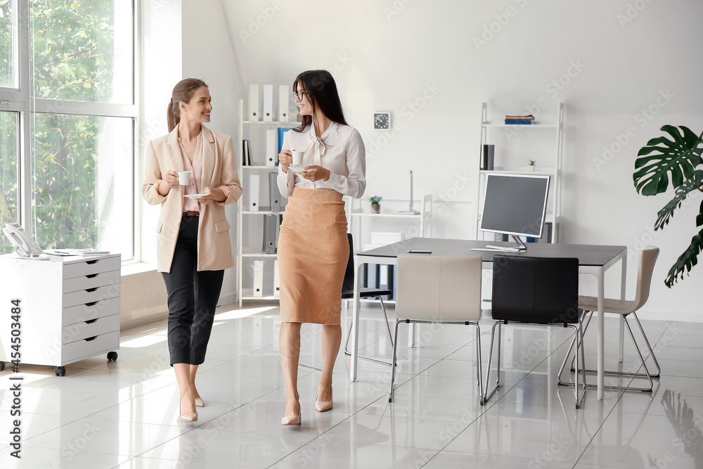 Business people having coffee break in office