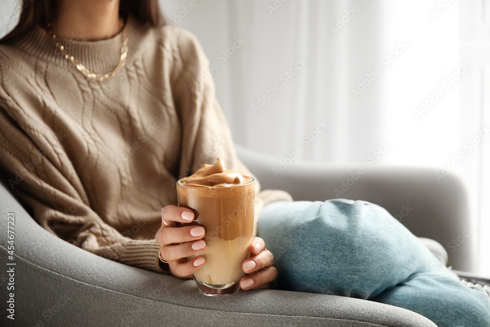 Woman drinking tasty coffee at home, closeup