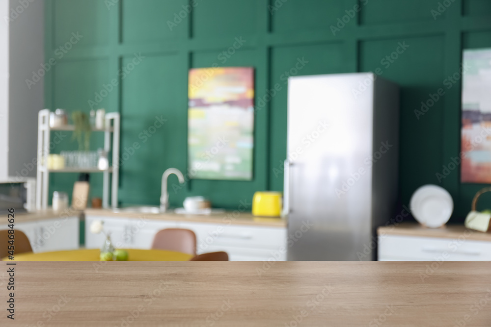 Empty table on blurred kitchen interior background