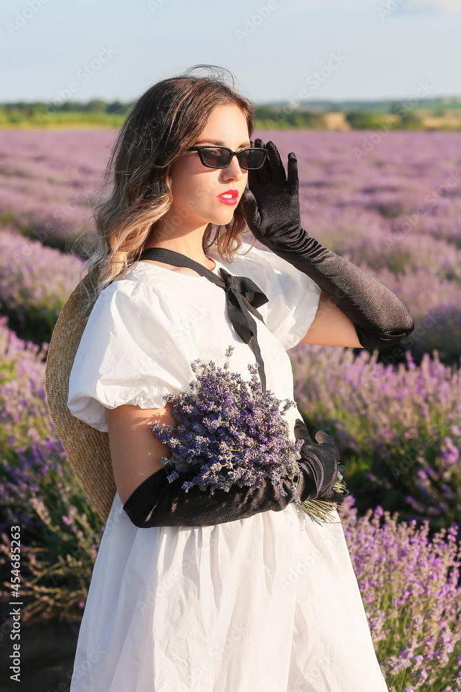 Beautiful young woman in lavender field