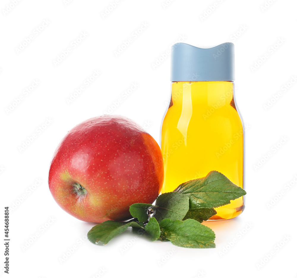 Bottle of tasty apple juice on white background