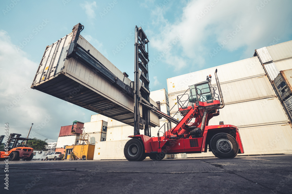 Cargo container for overseas shipping in shipyard with heavy machine . Logistics supply chain manage