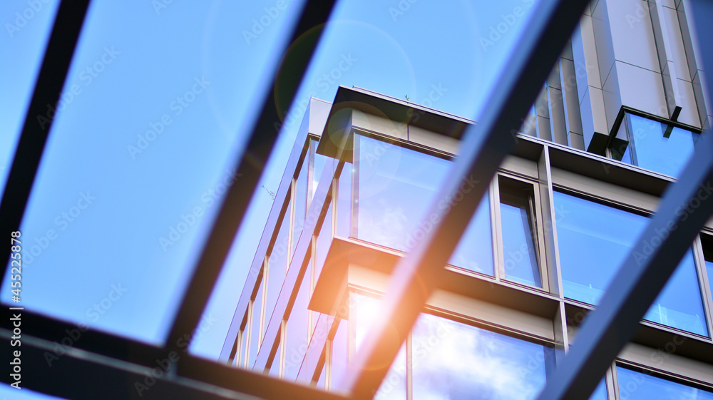 Fragment of glass and metal facade walls. Commercial office buildings. Abstract modern business arch