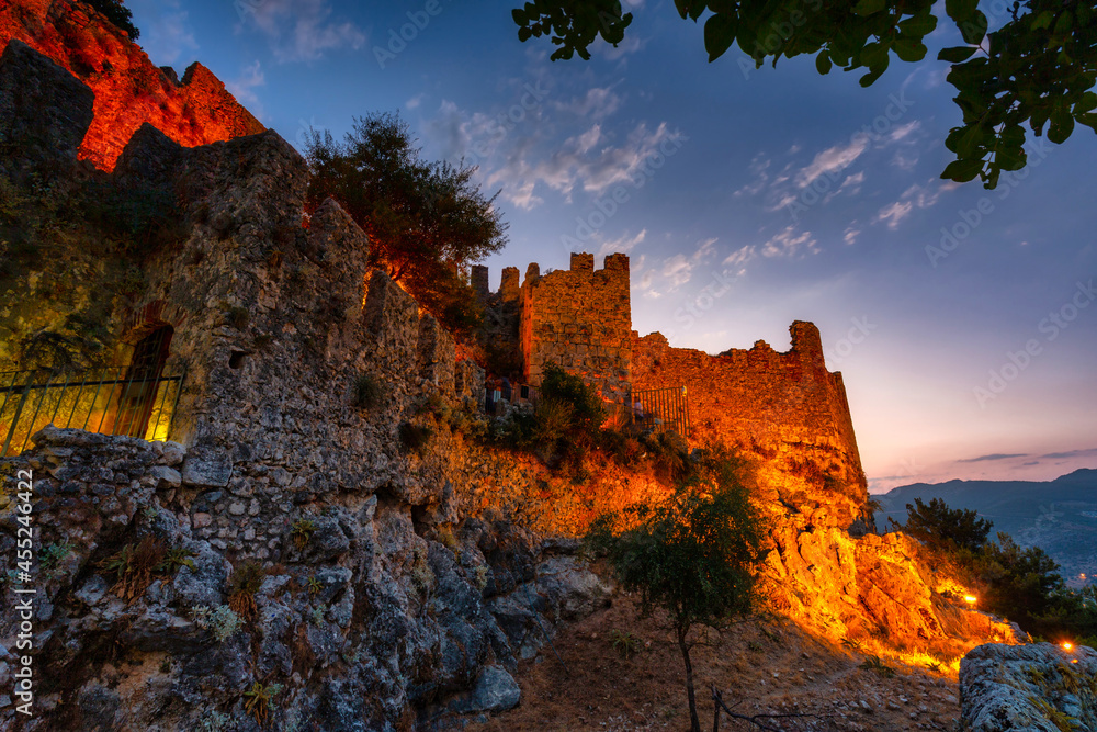 Beautiful castle on the hill in Alanya city at sunset. Turkey