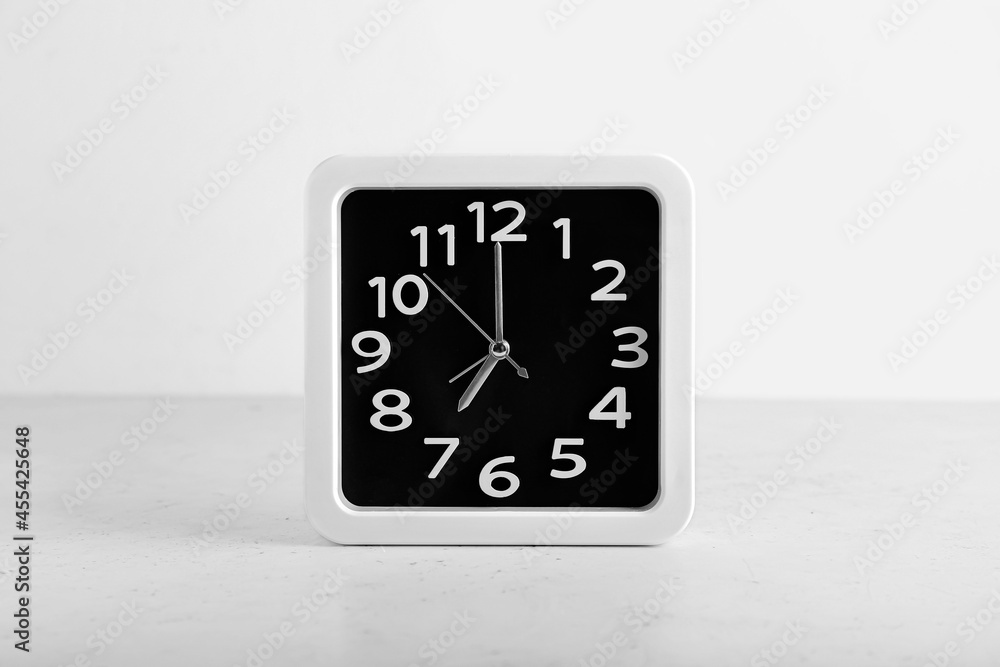 Stylish clock on white background