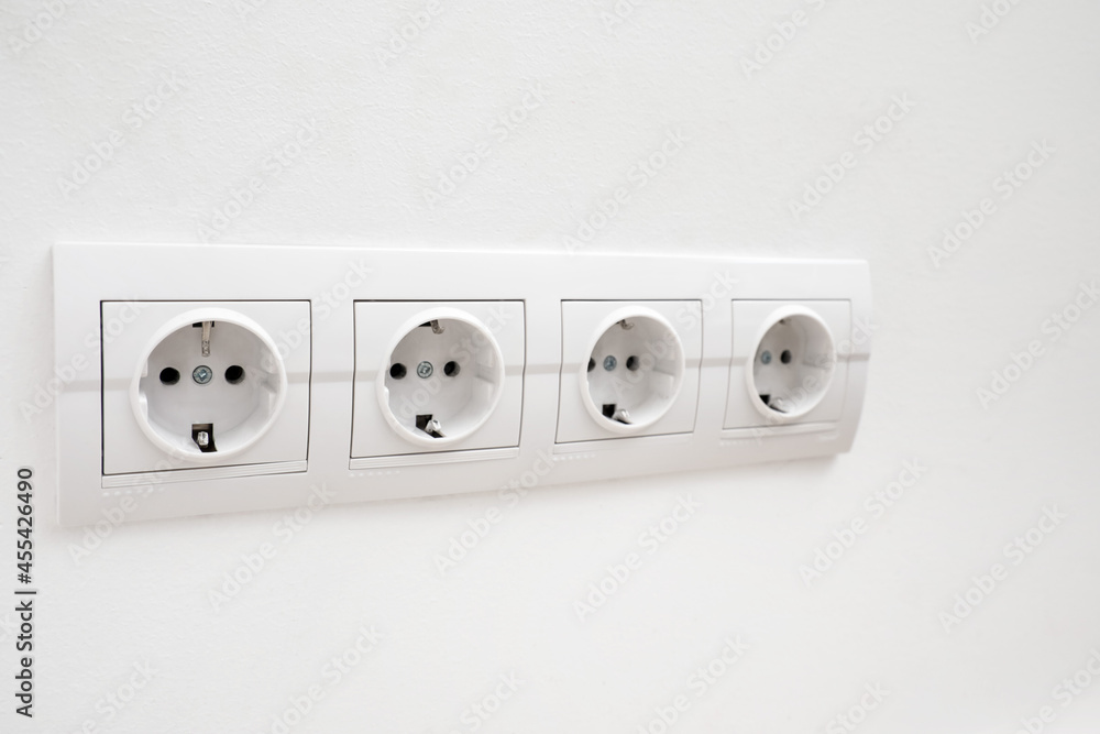 Electric socket on light wall