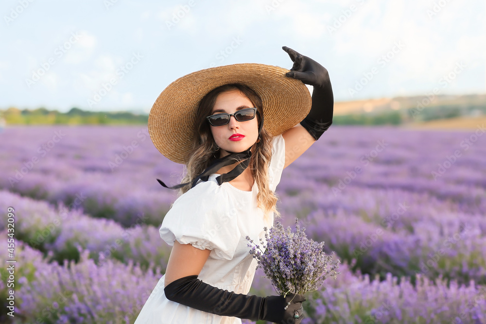 Beautiful young woman in lavender field