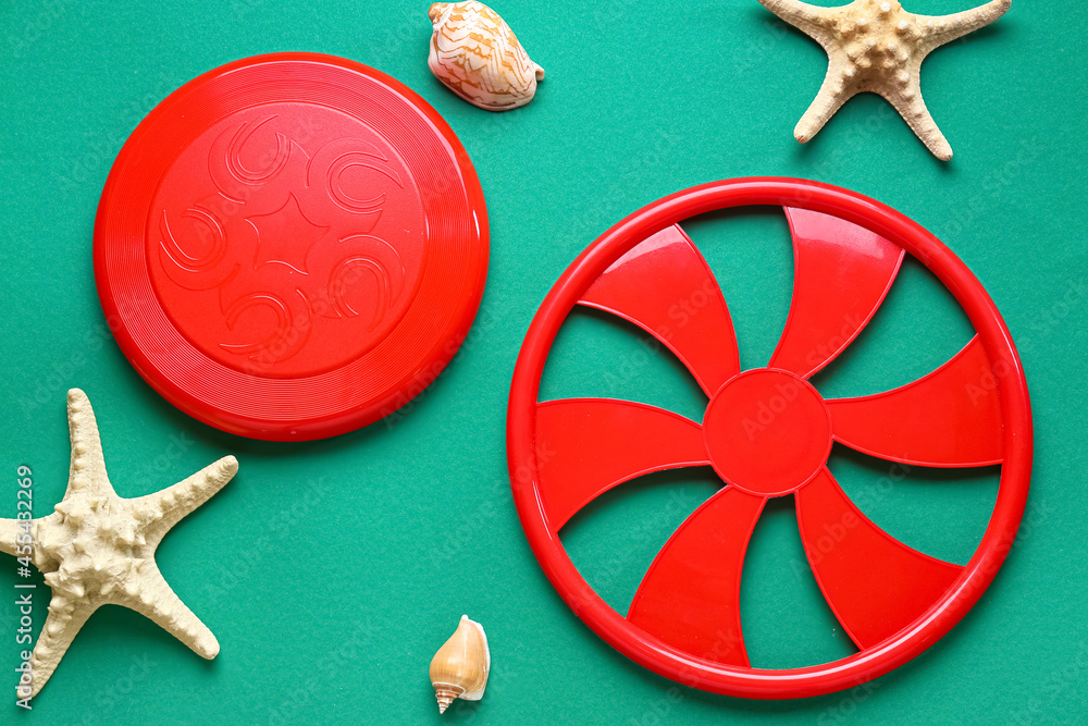 Frisbee disks and starfishes on color background