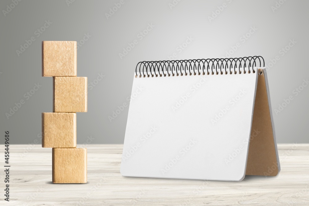 2022 concept with cubes on wooden table background, mockup calendar