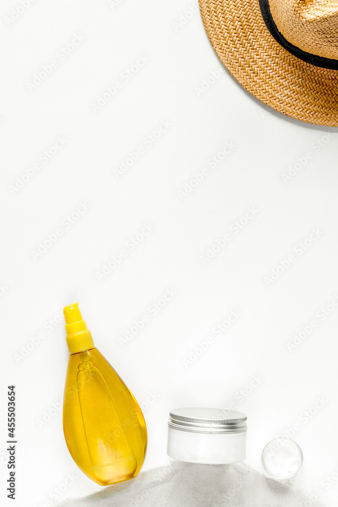 Sun protection concept with cream and lotion white background top view mockup