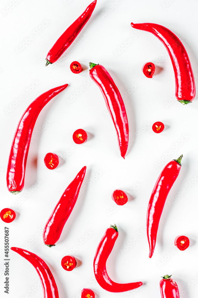 red food with chili pepper on white background top view pattern