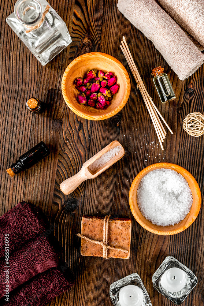 bathroom salt and natural soap for spa on wooden background top view