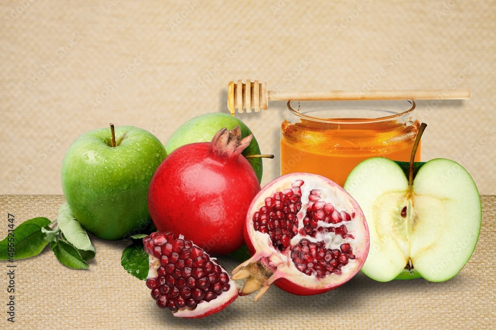 Apples, pomegranates and honey. Happy Rosh Hashanah. Traditional religious Jewish holiday New Year.